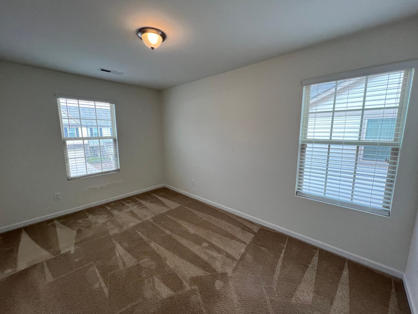 219 Cross Blossom Road Durham, NC 27703 - Photo 24 of 35 a view of an empty room with a window