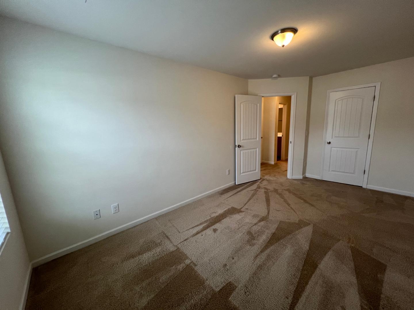 219 Cross Blossom Road Durham, NC 27703 - Photo 25 of 35 an empty room with a natural light