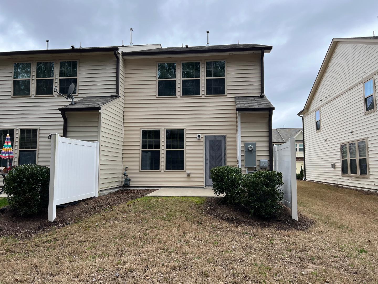 219 Cross Blossom Road Durham, NC 27703 - Photo 33 of 35 a view of a house with a yard and garage