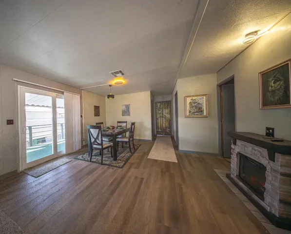 a view of a livingroom with furniture and a fireplace