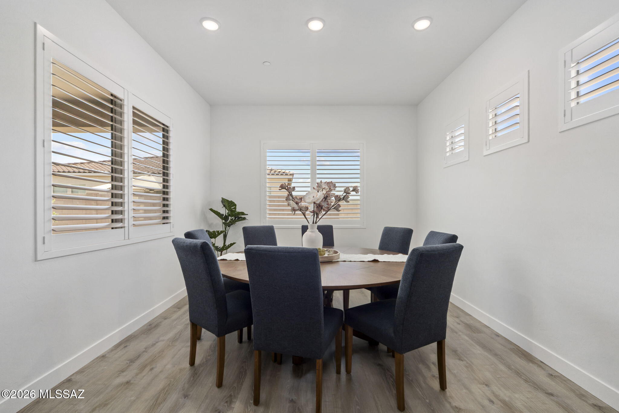 12791 East Tortoise Pointe Drive Vail, AZ 85641 - Photo 17 of 50 a view of a dining room with furniture and windows