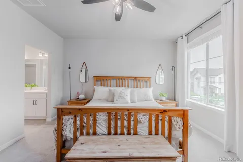 a bedroom with furniture and a window