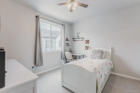 a bed room with a bed and a chandelier