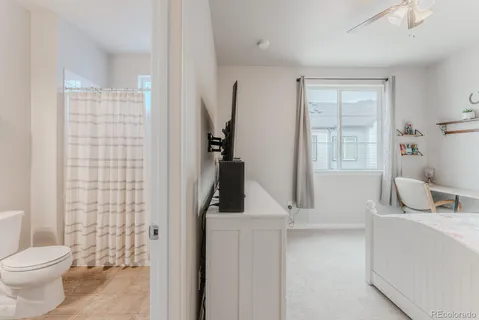 a bathroom with a toilet sink and a shower