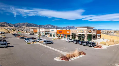 a view of a building with retail shops