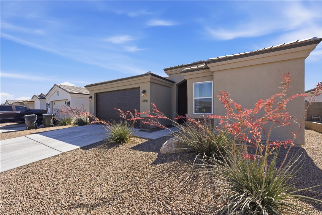3546 North Skylark Road Kingman, AZ 86409 - Photo 20 of 30 a front view of a house with garden