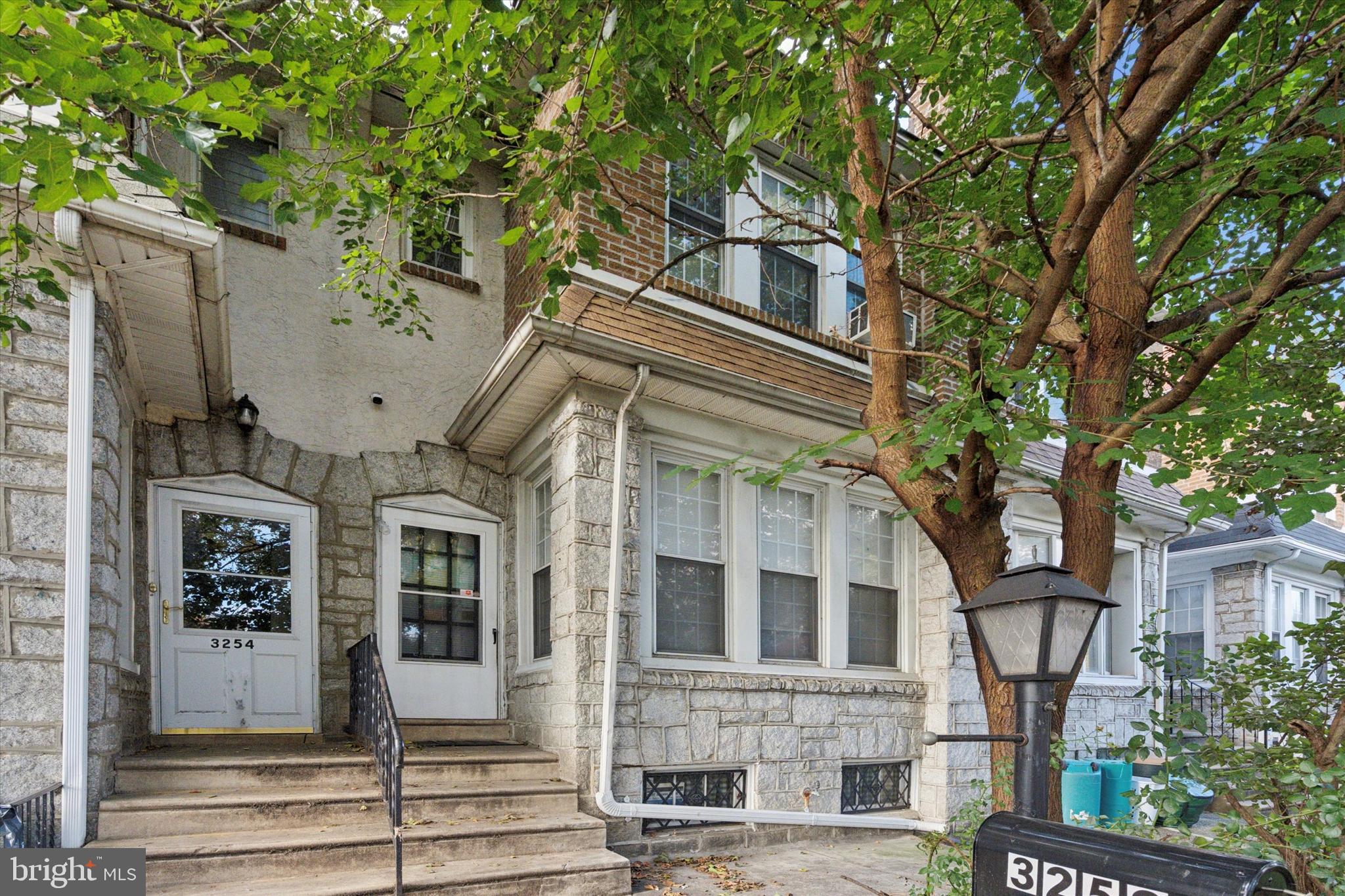 a view of a building with a tree