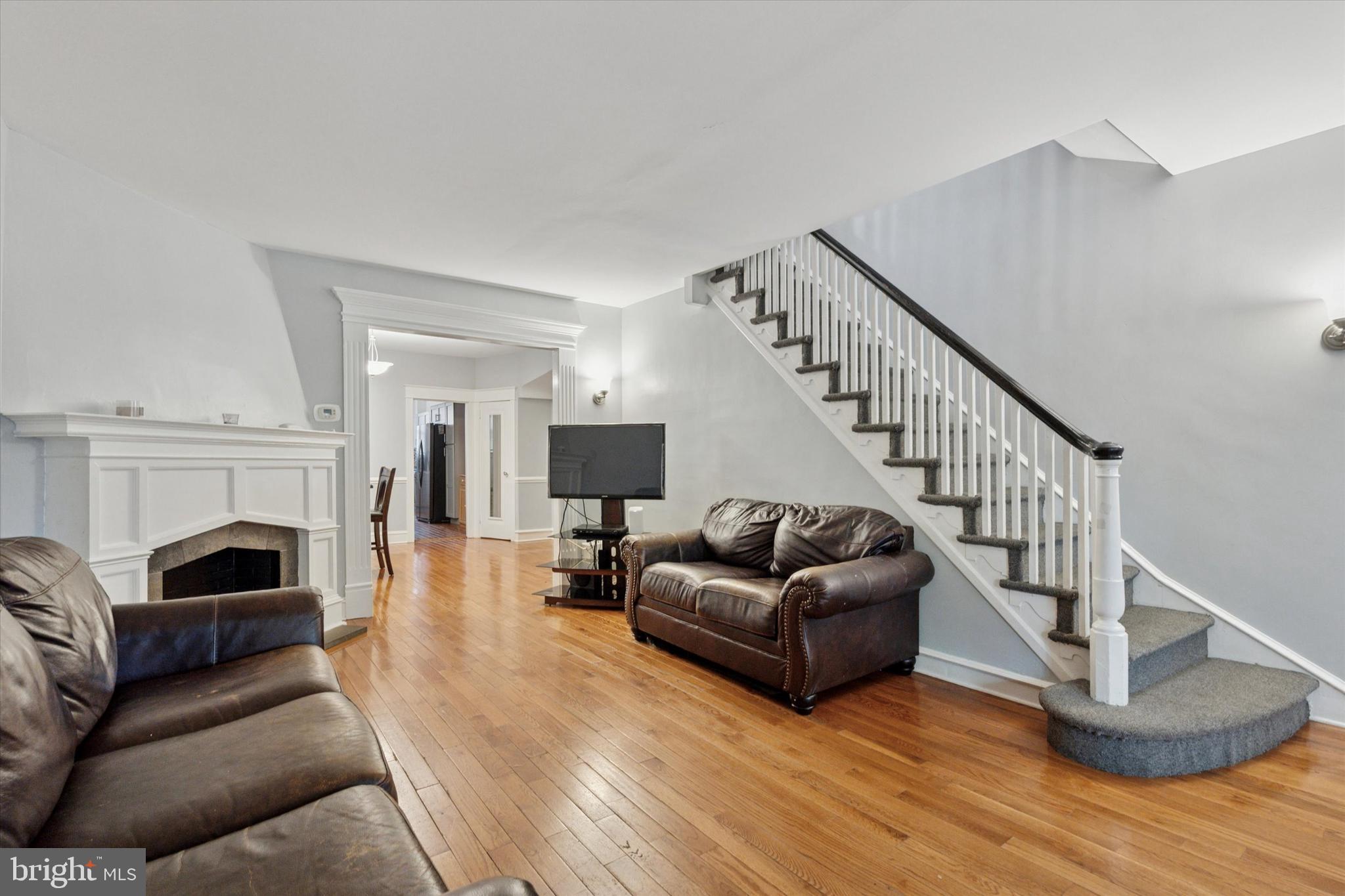 3252 Cottman Avenue Philadelphia, PA 19149 - Photo 3 of 15 a living room with furniture or a flat screen tv and a fireplace