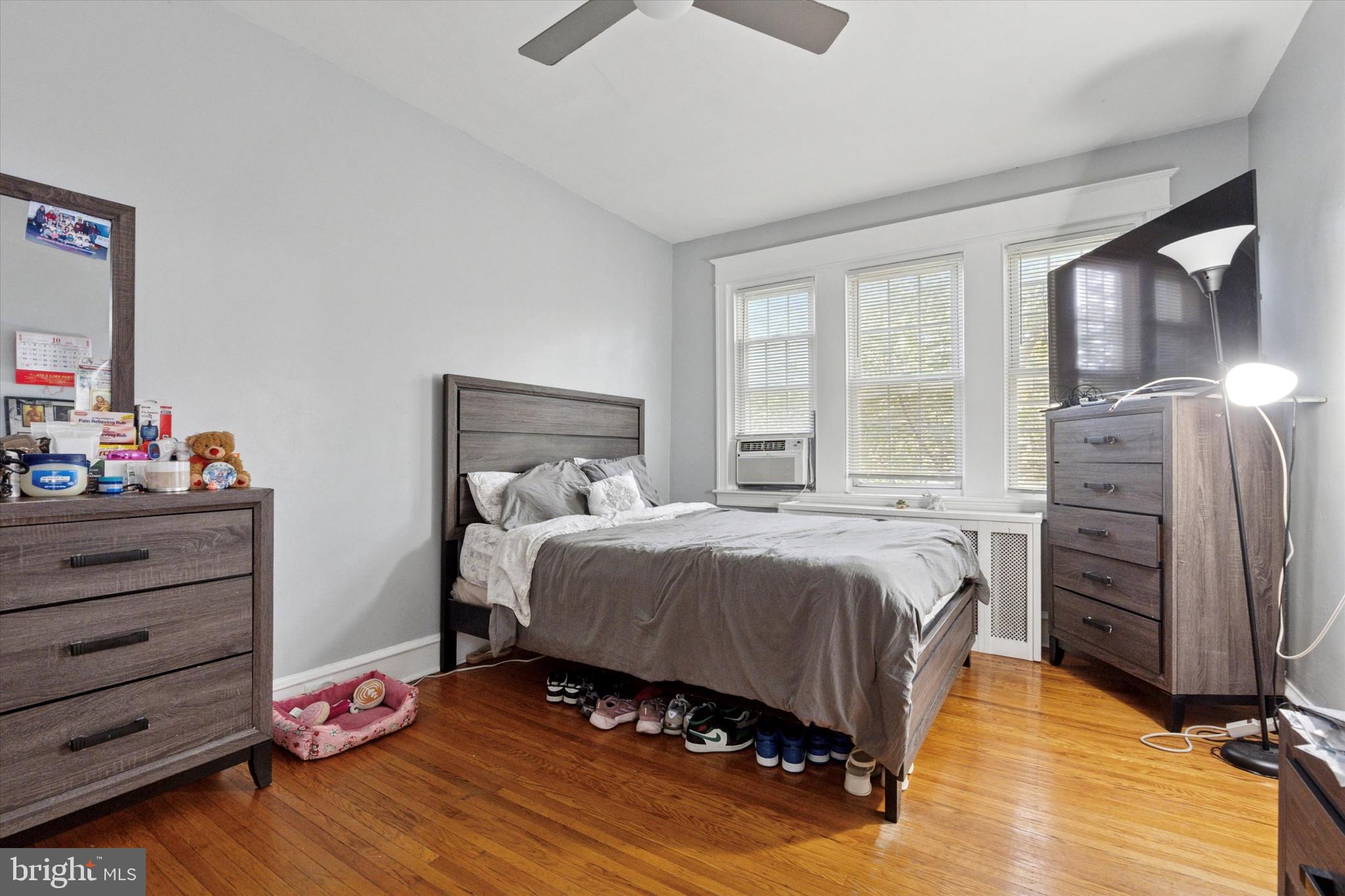 3252 Cottman Avenue Philadelphia, PA 19149 - Photo 9 of 15 a bedroom with a bed and wooden floor