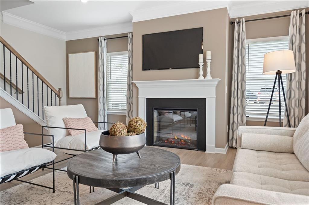 701 Sinclair Lane Temple, GA 30179 - Photo 21 of 46 a living room with furniture a flat screen tv and a fireplace