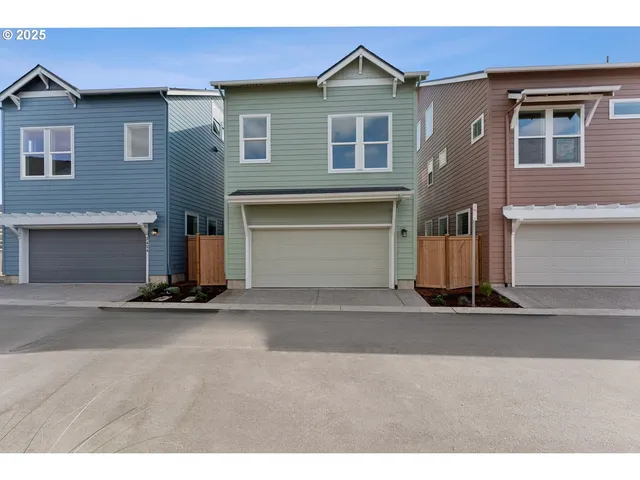 a front view of a house with a garage