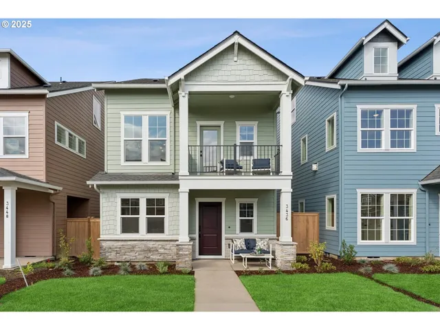 a front view of a house with yard and seating