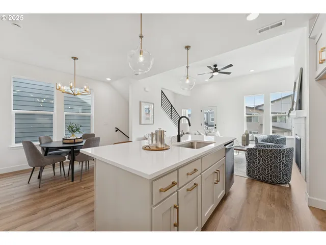 a kitchen that has a table and chairs in it