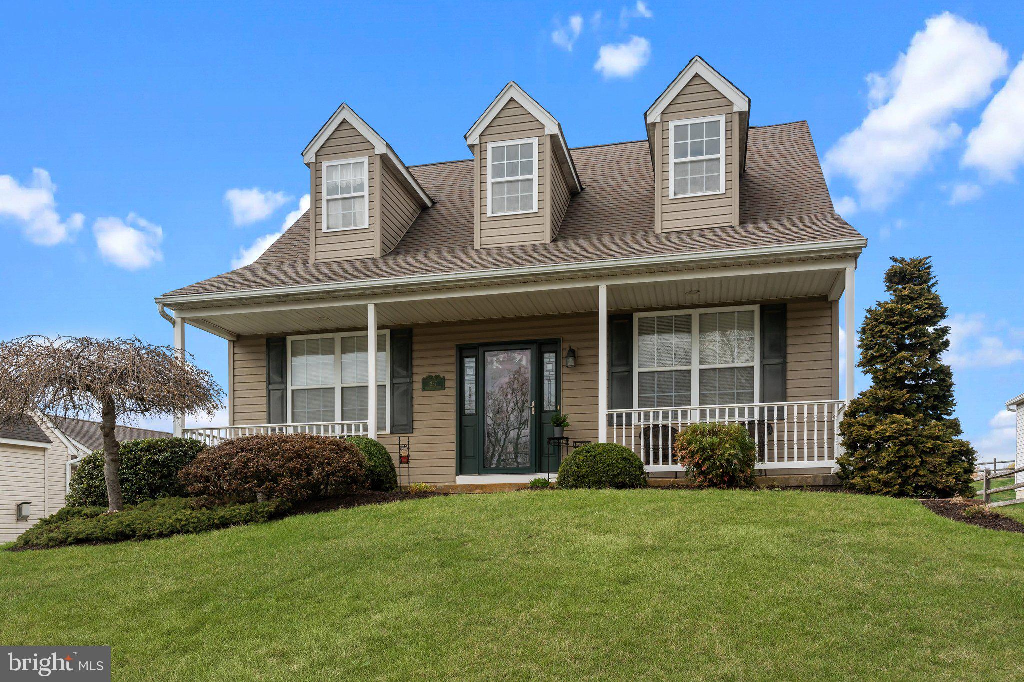 237 Beaumont Drive Oxford, PA 19363 - Photo 2 of 46 a view of a brick house with a yard plants and large tree
