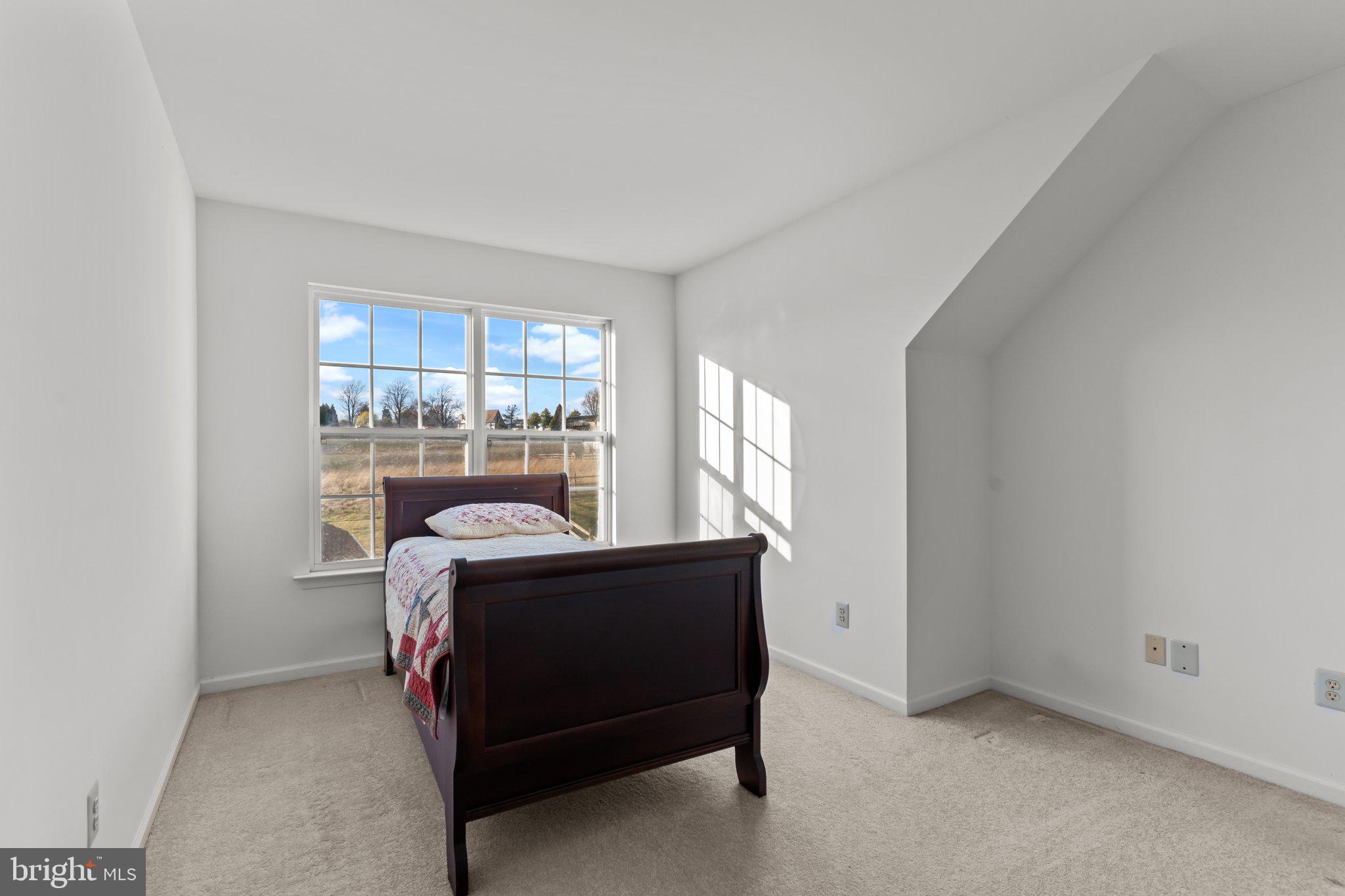 237 Beaumont Drive Oxford, PA 19363 - Photo 30 of 46 a bed sitting in a room next to a window