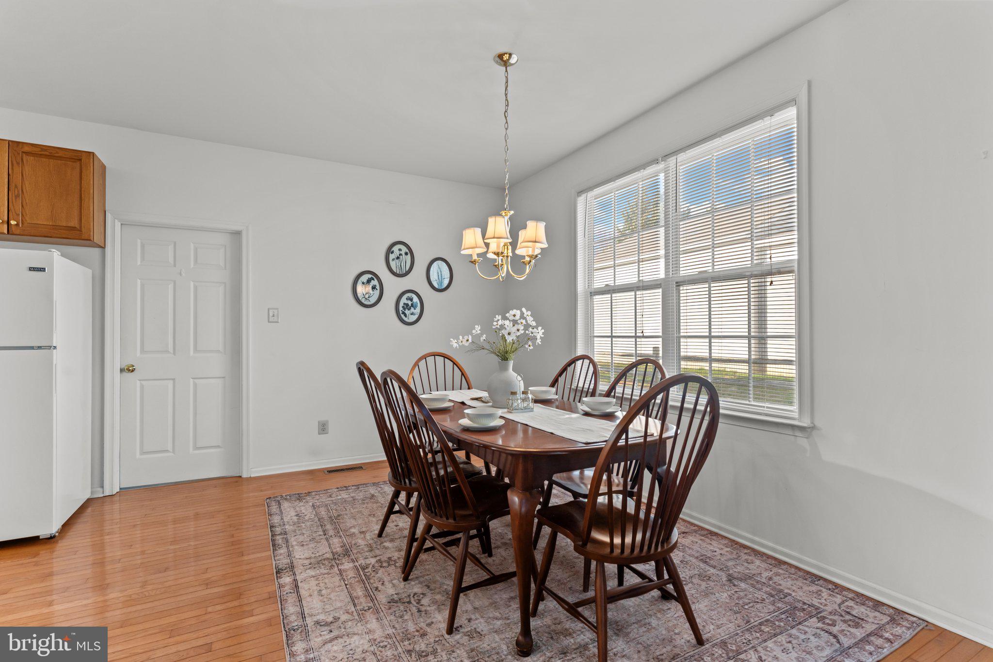 237 Beaumont Drive Oxford, PA 19363 - Photo 9 of 46 a view of a dining room with furniture window and wooden floor