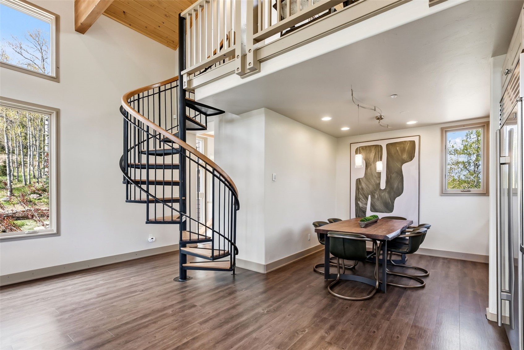 2800 Hunter's Knob Road Silverthorne, CO 80498 - Photo 13 of 37 a view of a hallway with wooden floor and furniture