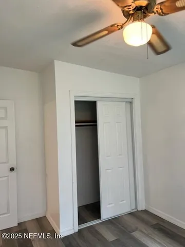 a view of a room with a sink and a mirror