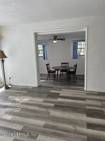 a view of dining room and wooden floor