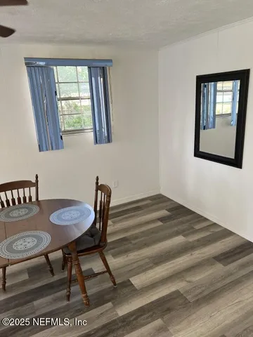 a workspace with furniture and window