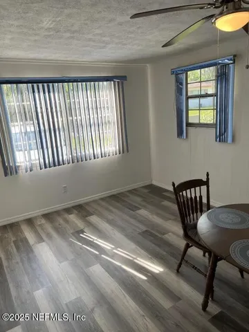 a view of a livingroom with furniture and window