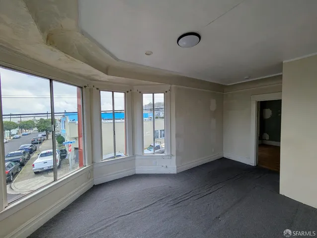 a view of an empty room with a window