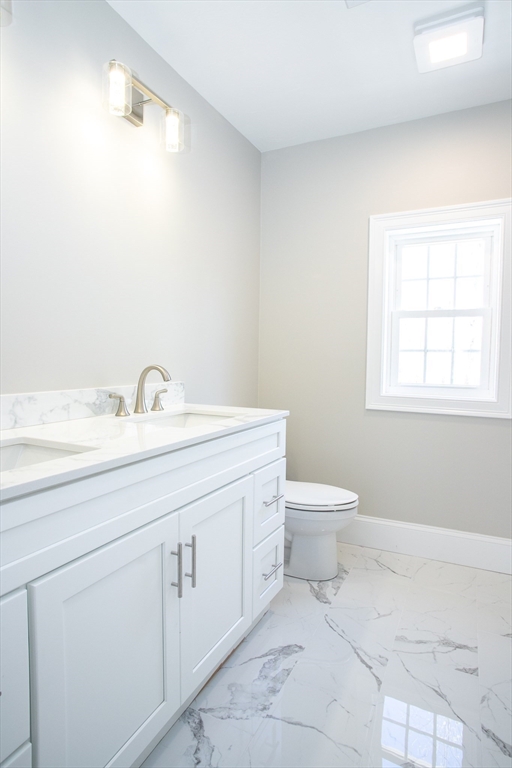 67 Willard Road Ashburnham, MA 01430 - Photo 38 of 42 a bathroom with a toilet sink and mirror