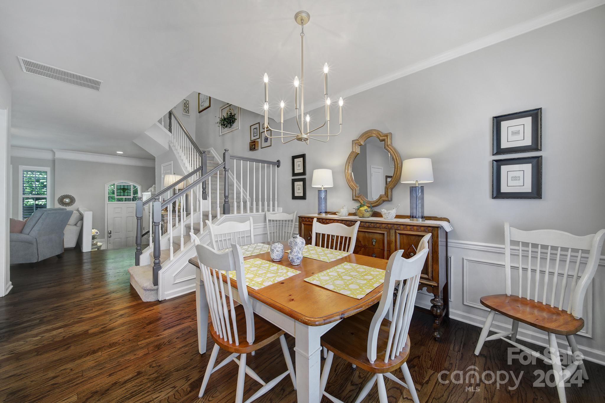 726 Passage Drive Fort Mill, SC 29708 - Photo 13 of 43 a view of a dining room with furniture and wooden floor