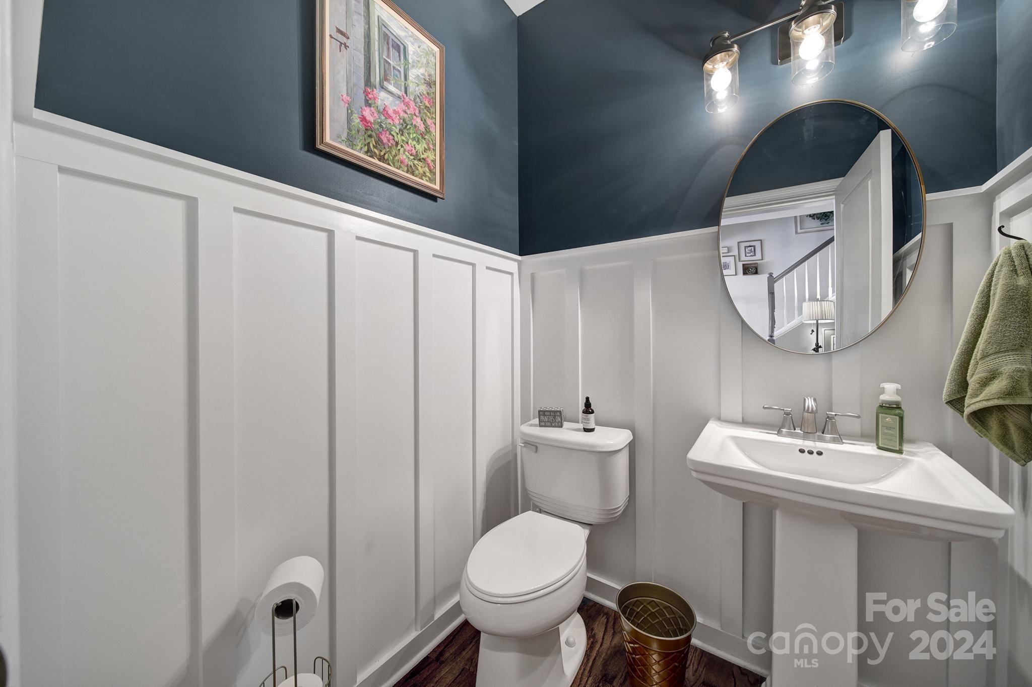 726 Passage Drive Fort Mill, SC 29708 - Photo 14 of 43 a bathroom with a toilet sink and mirror