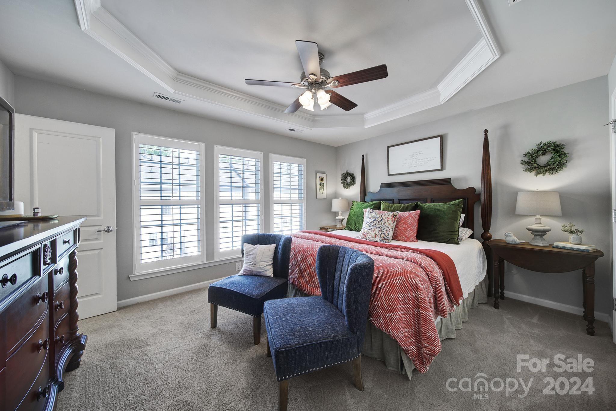 726 Passage Drive Fort Mill, SC 29708 - Photo 15 of 43 a bedroom with a bed and a chandelier