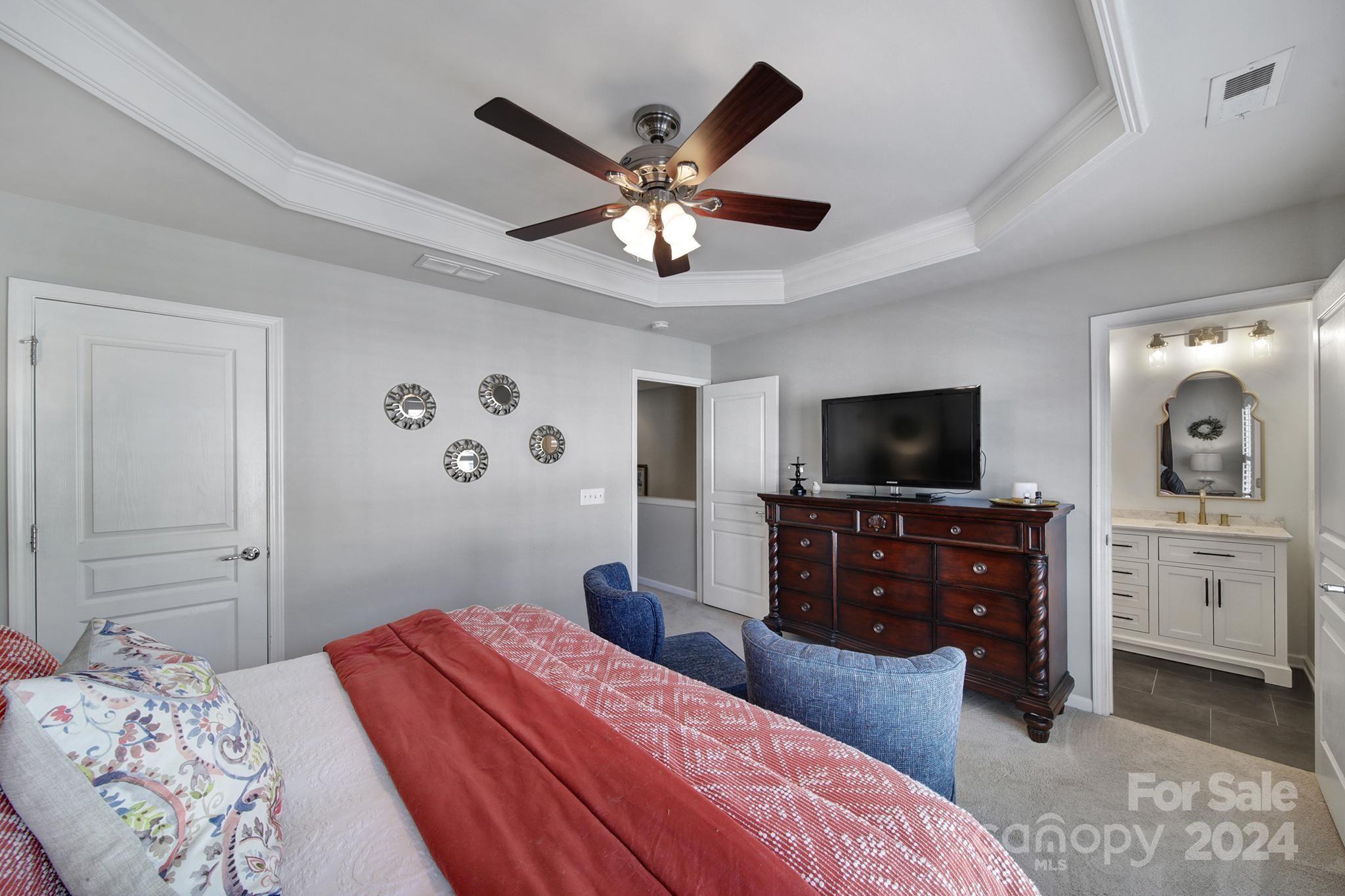 726 Passage Drive Fort Mill, SC 29708 - Photo 16 of 43 a bedroom with a bed and a flat screen tv