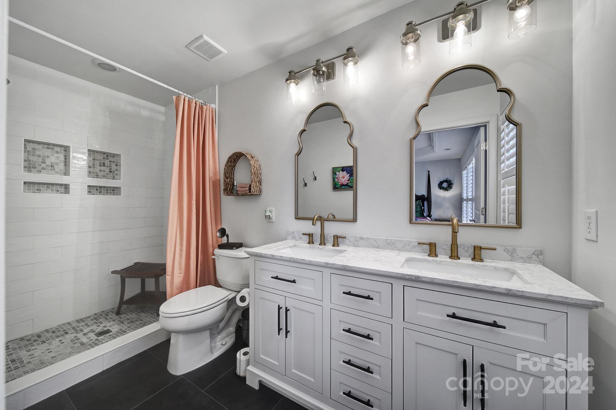726 Passage Drive Fort Mill, SC 29708 - Photo 17 of 43 a bathroom with a double vanity sink mirror and toilet