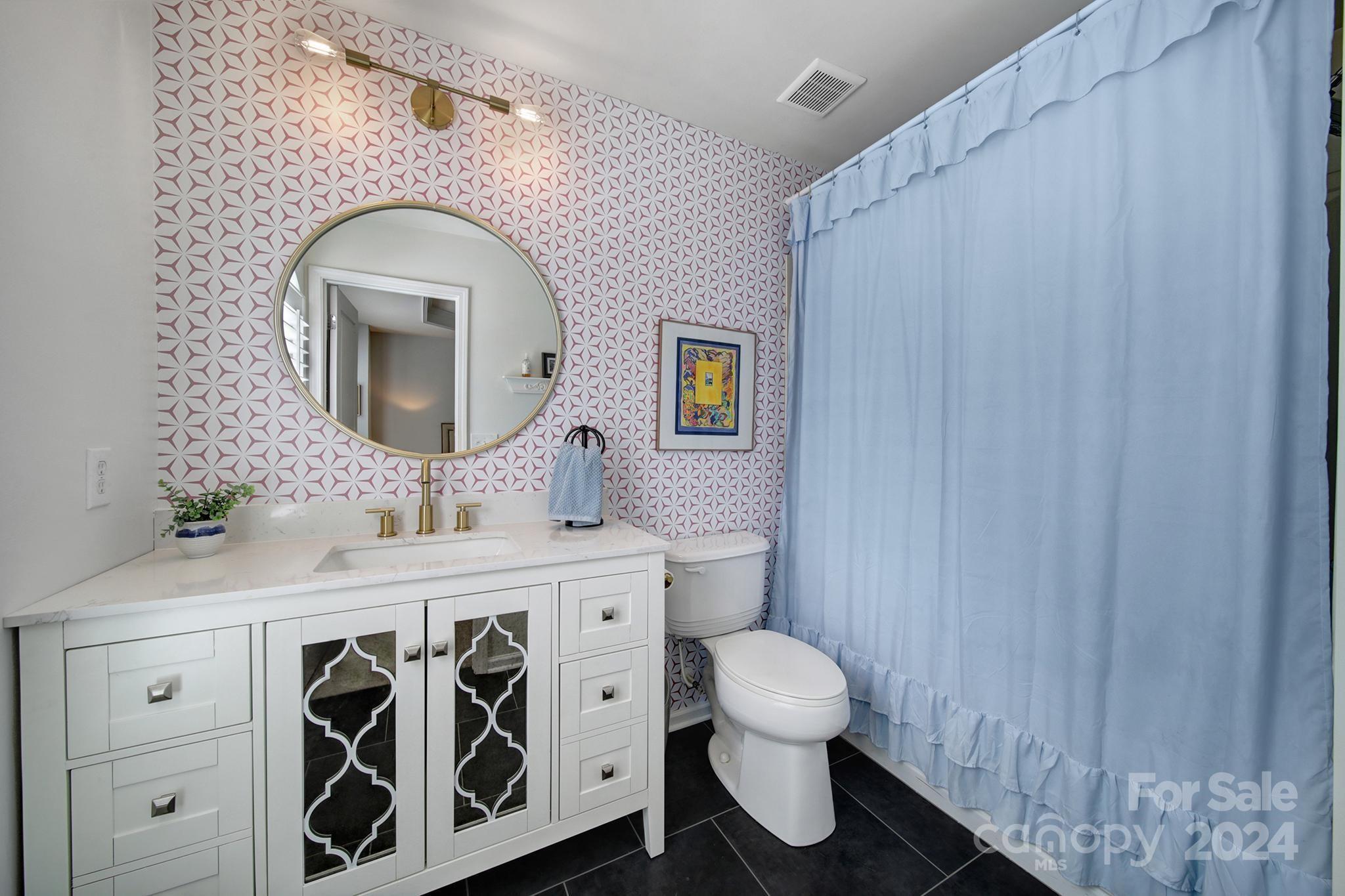 726 Passage Drive Fort Mill, SC 29708 - Photo 21 of 43 a bathroom with a toilet sink vanity granite and a mirror