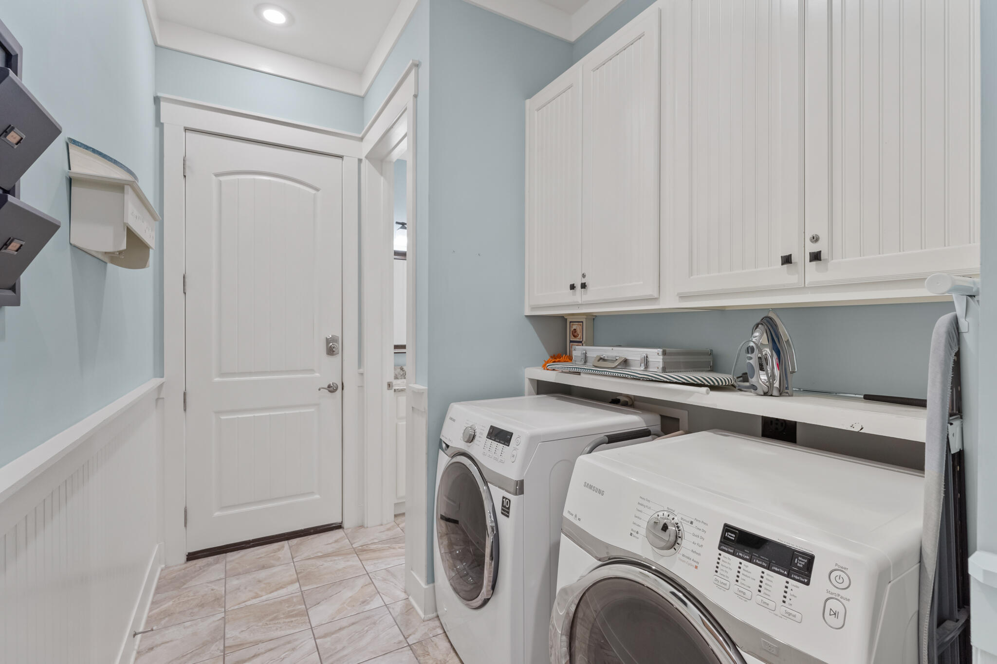 119 West Lifeguard Loop Inlet Beach Inlet Beach, FL 32461 - Photo 52 of 75 a view of washer and dryer with kitchen in the background