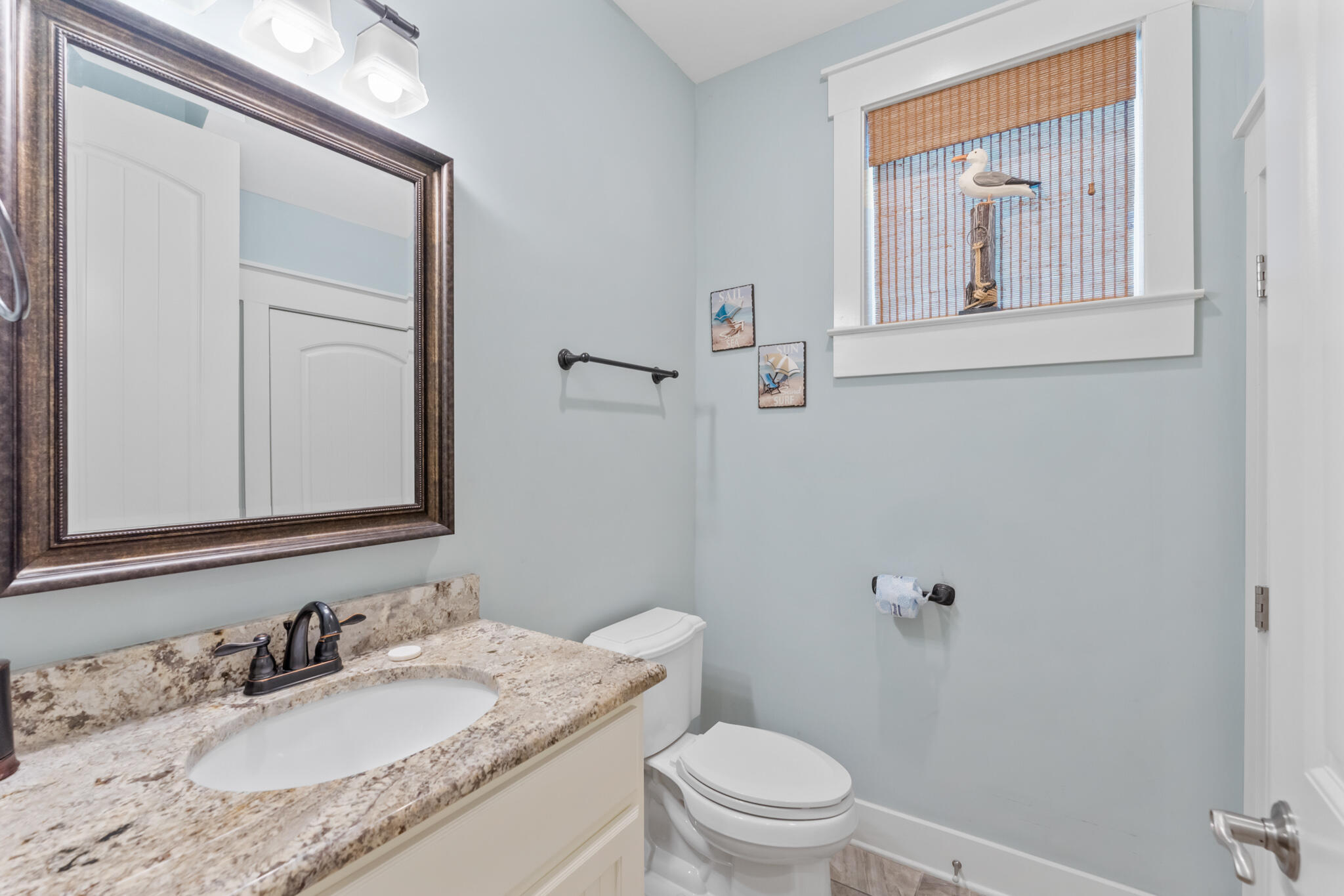 119 West Lifeguard Loop Inlet Beach Inlet Beach, FL 32461 - Photo 53 of 75 a bathroom with a granite countertop sink toilet and mirror