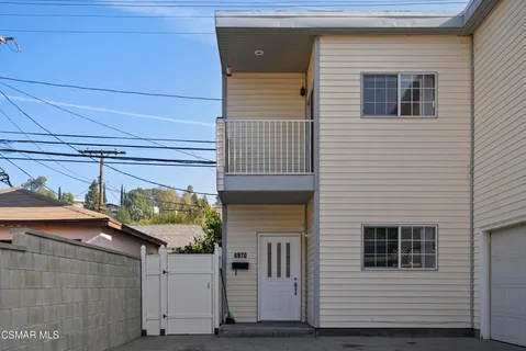 a front view of a house with garage