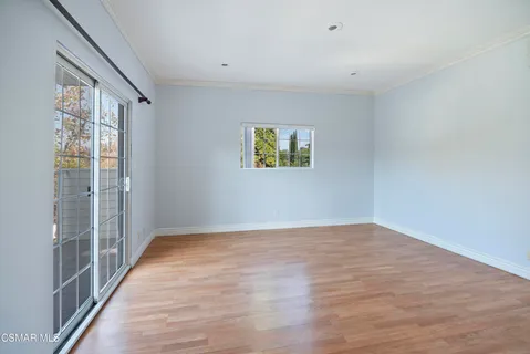 a view of an empty room with glass door