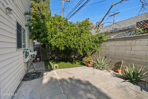 a view of a backyard of the house