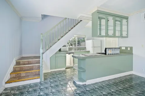 a view of entryway and kitchen