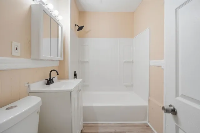 a bathroom with a sink a toilet and a bathtub