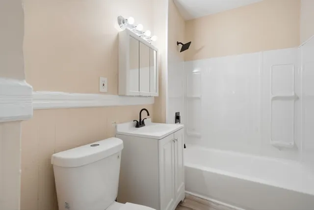a bathroom with a sink a toilet and bathtub