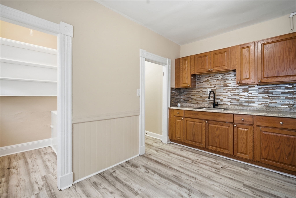 201 Main Street Springfield, MA 01108 - Photo 7 of 25 a kitchen with stainless steel appliances granite countertop a refrigerator and a stove top oven
