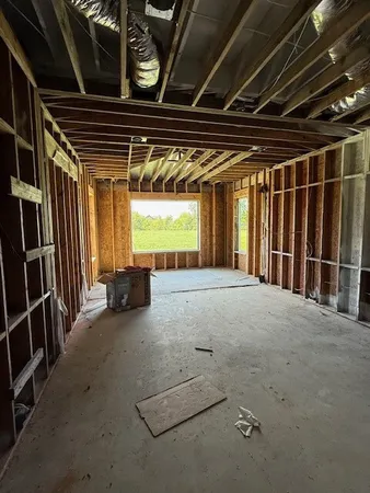 a view of an empty room with a fireplace