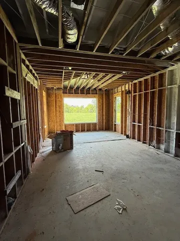 a view of an empty room with a fireplace