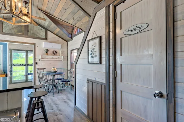 a view of living room with furniture and fireplace