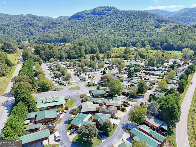 an aerial view of a pool patio swimming pool and outdoor seating