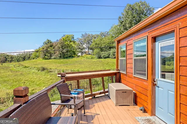 a view of balcony with furniture