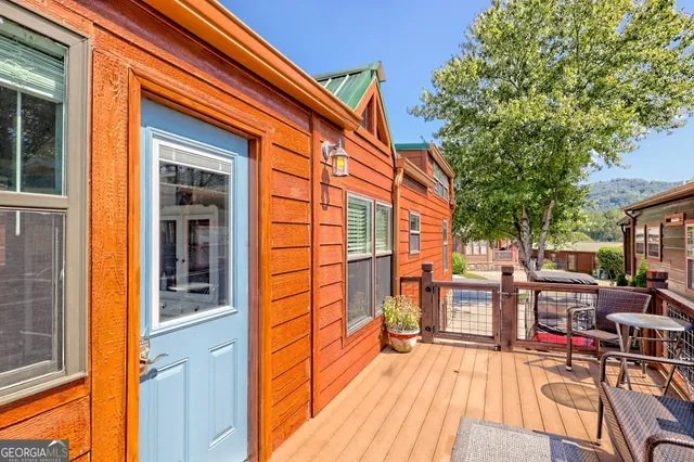 a view of a two chairs in the balcony