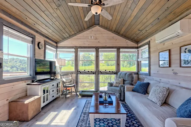 a view of a livingroom with furniture staircase windows and terrace