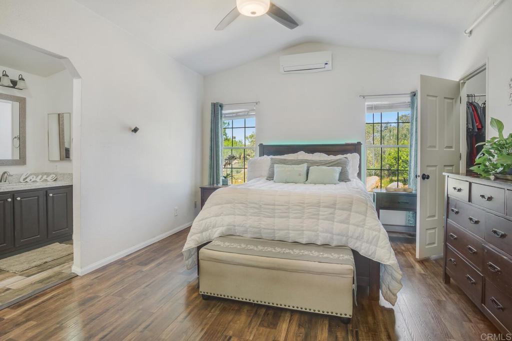 3465 Barrett View Road Alpine, CA 91901 - Photo 10 of 36 a bedroom with a bed and a dresser with mirror